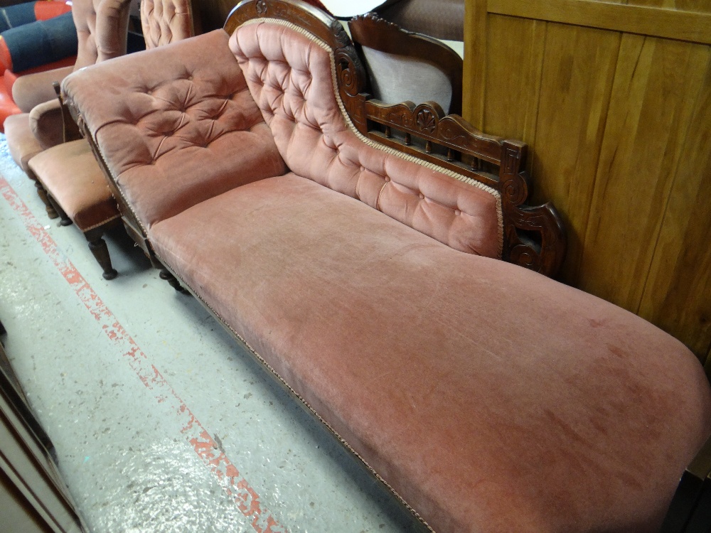 An antique chaise longue, similarly upholstered armchair & button back chair (all distressed)