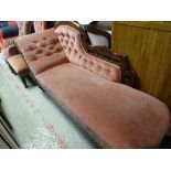An antique chaise longue, similarly upholstered armchair & button back chair (all distressed)