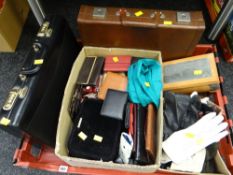 Crate containing two briefcases & a large selection of leather gloves, purses etc