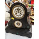 A large black slate dome topped & scroll side decorated mantel clock with barometer