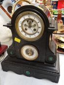 A large black slate dome topped & scroll side decorated mantel clock with barometer