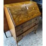 A burr effect three-drawer sloped vintage bureau