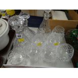 A collection of crystal glass including three decanters, brandy bowls etc