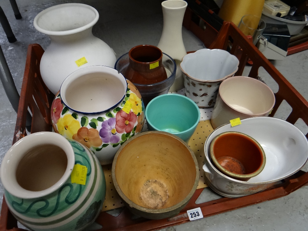 Crate of various decorative ceramic planters