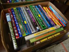 A box of comic annuals & Guinness World Record albums