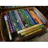 A box of comic annuals & Guinness World Record albums