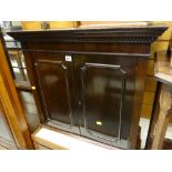 An antique mahogany table top cabinet with shelved interior