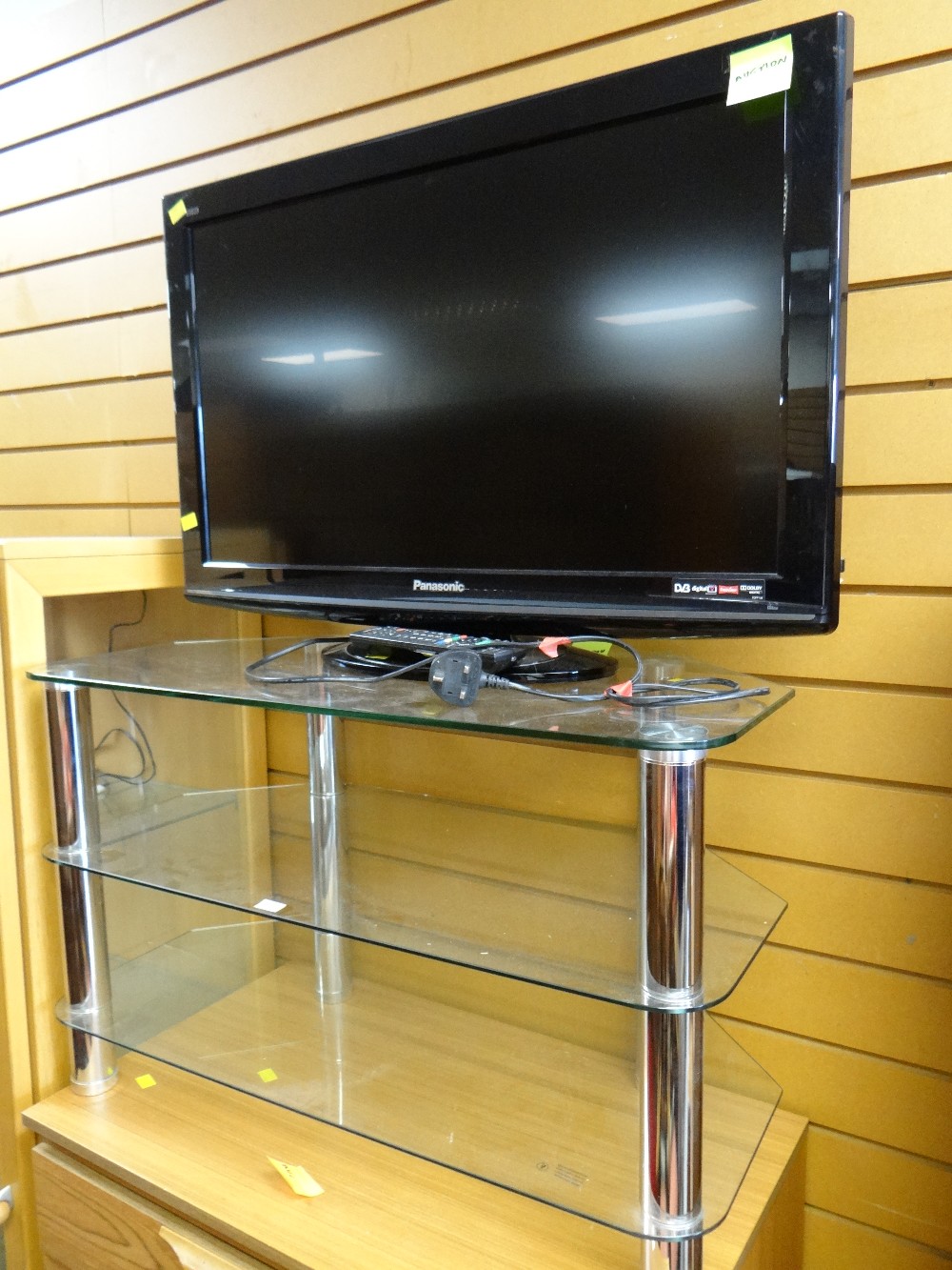 A Panasonic 32-inch flat screen TV & stand E/T