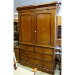 A Victorian mahogany press cupboard with four-drawer base