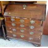 An antique oak bureau with good brass furniture (distressed)