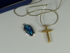 A believed 9ct gold cross with diamond & chain together with a New Zealand paua shell pendant