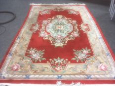 Red ground Chinese washed rug, 180 x 280cms