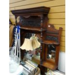 A good Edwardian carved overmantel mirror with shelves