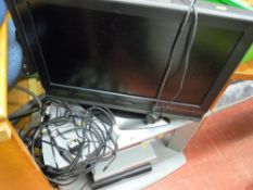 Panasonic LCD flatscreen TV with stand, a Sharp DV-740 CD player, Sky Plus HD box and Sky digibox