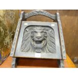 Vintage oak coal scuttle with lion mask carving to the front
