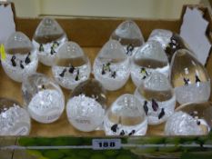 Collection of glass paperweights with penguin interiors