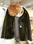 Two lady's faux fur jackets, two hats and a pair of small hand gloves