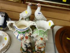 Pair of Staffs flatback pigeons, two early 19th Century hand painted jugs and a pair of reproduction