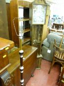 Polished wood drop leaf dining table, modern grandfather clock and a standard lamp