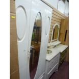White painted single door wardrobe with base drawer, three drawer dressing table and another