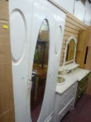 White painted single door wardrobe with base drawer, three drawer dressing table and another