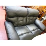 Black faux leather settee and a recliner armchair