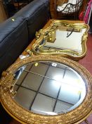 Oval gilt framed mirror with extending sconce and an ornate gilt framed mirror