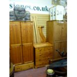 Suite of modern pine bedroom furniture including two wardrobes, chest of drawers and bed frame