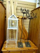 Pair of black metal ornate floorstanding candleholders and a white painted metal and glass small