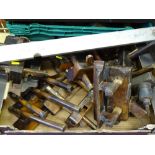 Box of vintage plough planes and a well used metal spirit level