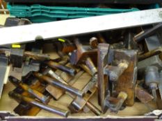 Box of vintage plough planes and a well used metal spirit level