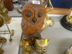 Two brass owls and a carved wooden owl