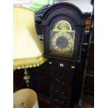 Eight day striking grandmother clock in an ebonized Jacobean style case with domed and spiral