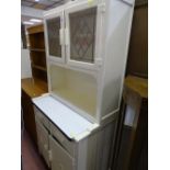 White painted kitchen dresser with enamel centre drawer shelf and two drawers and two cupboards