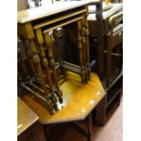 Nest of three mahogany coffee tables with spindle legs and an Edwardian octagonal mahogany