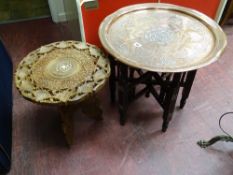 Benares copper and white metal circular tray table on folding supports and a small carved native
