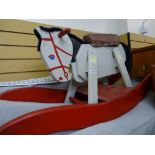 Child's wooden rocking horse in primitive but appealing fashion