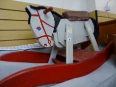 Child's wooden rocking horse in primitive but appealing fashion