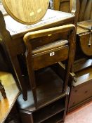 Two box seat piano stools, a small circular topped stool and a polished shelved coffee table