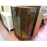 Polished serpentine front centre door glass display cabinet