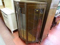 Polished serpentine front centre door glass display cabinet