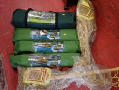 Parcel of three small fishing tents, a three person tent and two bagged wooden bead door curtains (