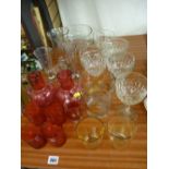 Pair of cranberry glass jugs, tumblers and other glassware including measures etc