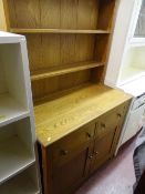 Compact light oak dresser having two upper shelves and two drawers and two cupboards