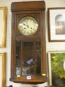 Polished oak cased pendulum wall clock