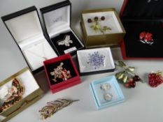 Collection of boxed costume jewellery brooches etc