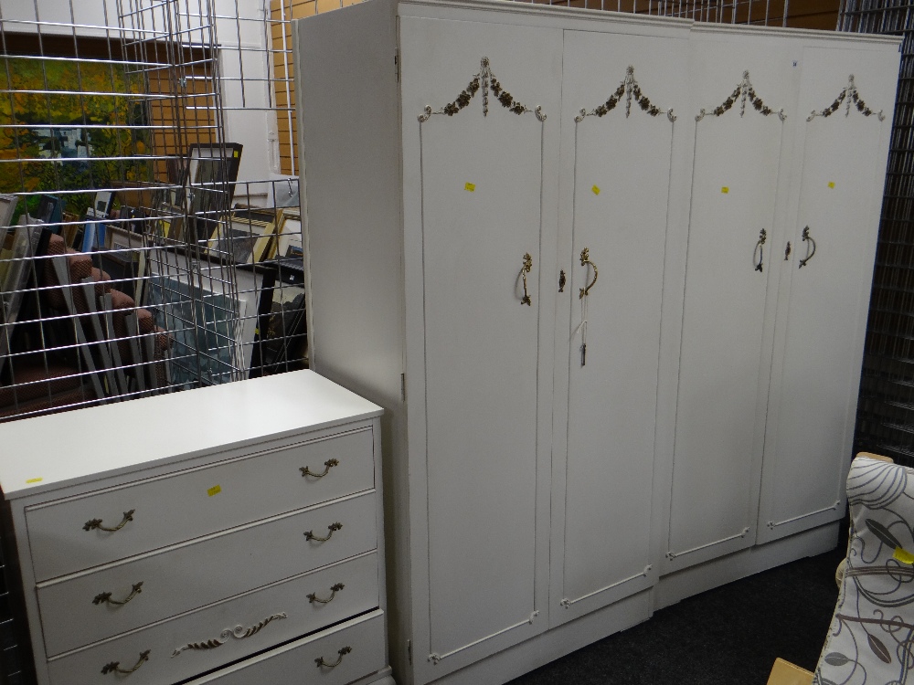 A parcel of white painted bedroom furniture