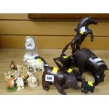 Collection of carved wooden animals together with a selection of resin & other animal figures