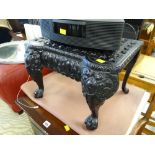 A black painted metallic antique footsman