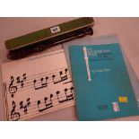 A vintage Dolmetsch recorder together with some recorder music books